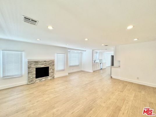 Empty room, Fireplace, Interior, Recessed Lighting, Stone Walls, Wood Texture Flooring