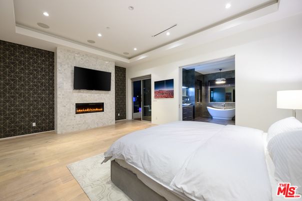 Bedroom, Fireplace, Interior, Pendant Lights, Recessed Lighting, Wood Texture Flooring