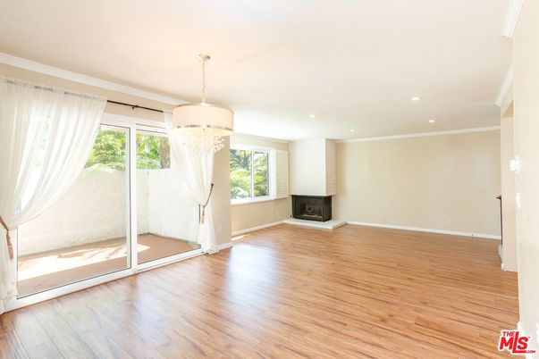 Chandelier, Empty room, Fireplace, Interior, Recessed Lighting, Wood Texture Flooring