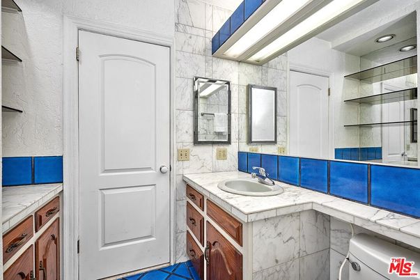 Bathroom, Dual Sink Vanities, Interior, Marble Walls, Recessed Lighting, Tile Countertops