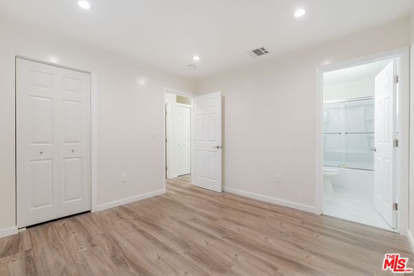 Bathroom, Empty room, Glass Shower, Interior, Recessed Lighting, Wood Texture Flooring