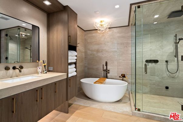 Bathroom, Chandelier, Dual Sink Vanities, Free Standing Baths, Glass Shower, Interior, Recessed Lighting, Wood Texture Flooring