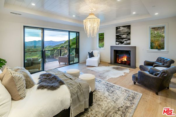 Bedroom, Chandelier, Fireplace, Interior, Living room, Recessed Lighting, Wood Texture Flooring