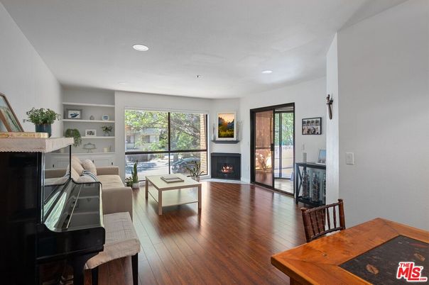 Dining room, Fireplace, Interior, Living room, Piano, Recessed Lighting, Wood Texture Flooring