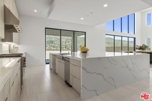Interior, Kitchen, Marble Walls, Recessed Lighting, Stainless Steel Appliances