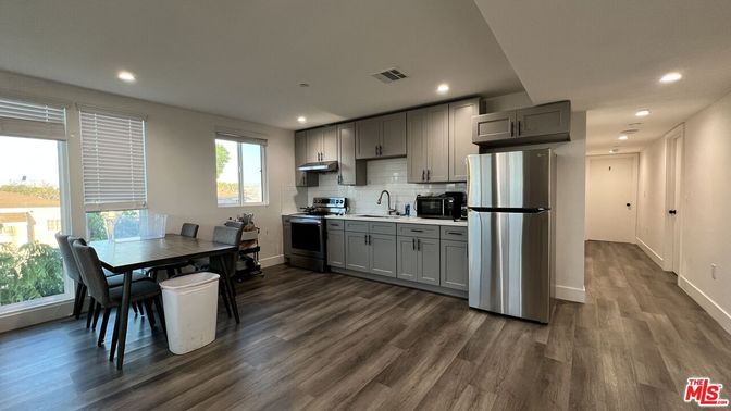 Dining room, Interior, Kitchen, Recessed Lighting, Stainless Steel Appliances, Wood Texture Flooring