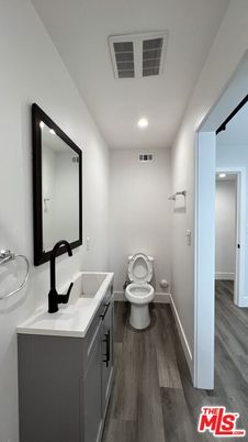 Bathroom, Dual Sink Vanities, Interior, Recessed Lighting, Wood Texture Flooring