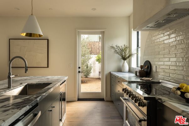 Interior, Kitchen, Pendant Lights, Recessed Lighting, Stainless Steel Appliances, Stone Walls, Wood Texture Flooring