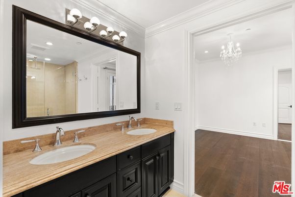Bathroom, Chandelier, Dual Sink Vanities, Interior, Recessed Lighting, Wood Texture Flooring