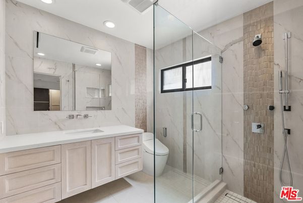 Bathroom, Dual Sink Vanities, Glass Shower, Interior, Marble Walls, Recessed Lighting