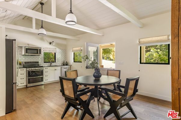 Dining room, Interior, Kitchen, Pendant Lights, Stainless Steel Appliances, Stone Walls, Wood Texture Flooring