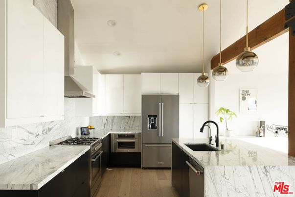 Interior, Kitchen, Marble Walls, Pendant Lights, Recessed Lighting, Stainless Steel Appliances, Wood Texture Flooring