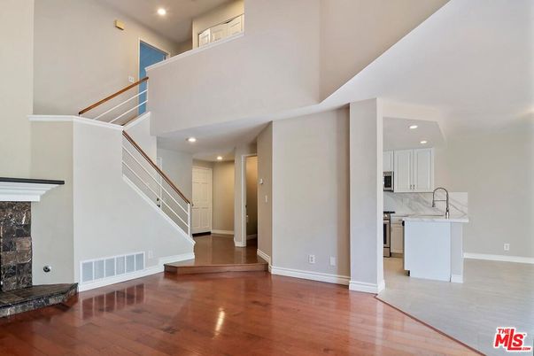 Fireplace, Interior, Kitchen, Recessed Lighting, Wood Texture Flooring