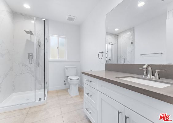 Bathroom, Dual Sink Vanities, Glass Shower, Interior, Marble Walls, Recessed Lighting