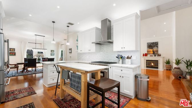 Dining room, Fireplace, Interior, Kitchen, Pendant Lights, Recessed Lighting, Stainless Steel Appliances, Wood Texture Flooring