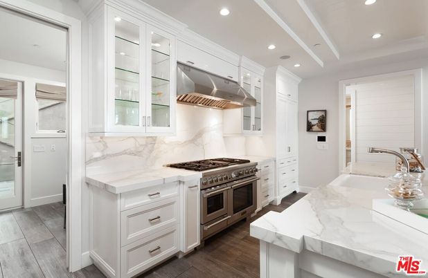 Interior, Kitchen, Marble Walls, Recessed Lighting, Stainless Steel Appliances, Wood Texture Flooring