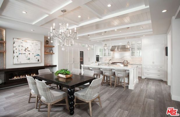 Chandelier, Dining room, Fireplace, Interior, Kitchen, Recessed Lighting, Stainless Steel Appliances, Wood Texture Flooring