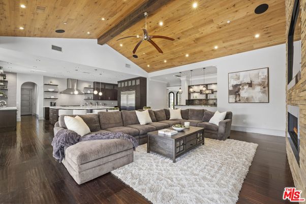 Fireplace, Interior, Kitchen, Living room, Pendant Lights, Recessed Lighting, Stainless Steel Appliances, Wooden Ceilings, Wood Texture Flooring