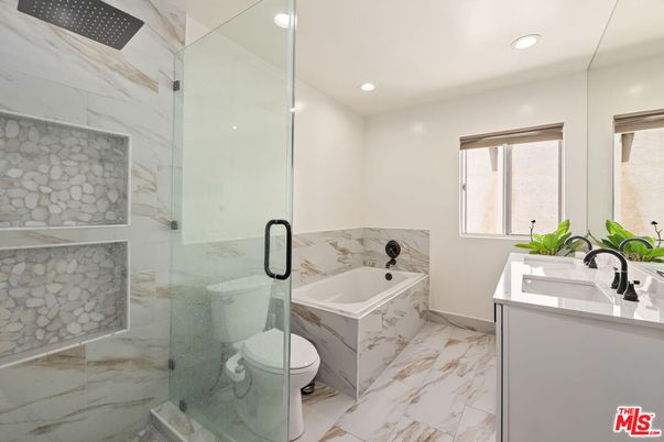 Bathroom, Dual Sink Vanities, Glass Shower, Interior, Marble, Marble Walls, Recessed Lighting