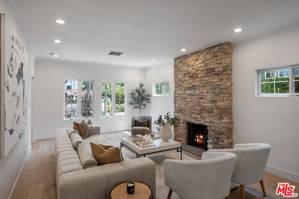 Fireplace, Interior, Living room, Recessed Lighting, Stone Walls, Wood Texture Flooring