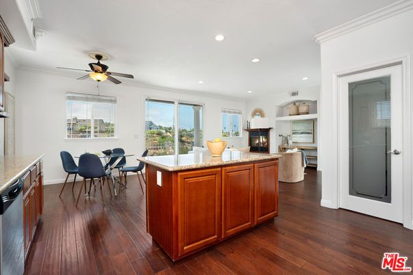 Dining room, Fireplace, Interior, Kitchen, Recessed Lighting, Wood Texture Flooring