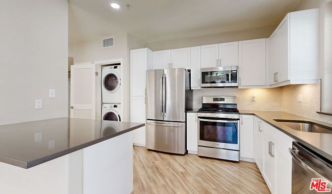 Interior, Kitchen, Recessed Lighting, Stainless Steel Appliances, Washer, Wood Texture Flooring