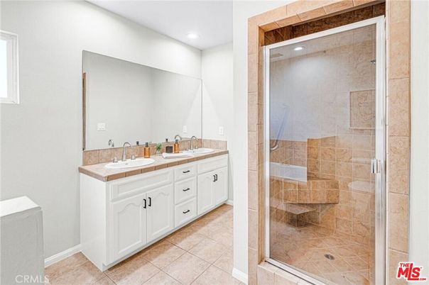 Bathroom, Dual Sink Vanities, Glass Shower, Interior, Recessed Lighting, Tile Countertops