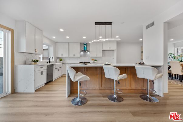 Interior, Kitchen, Marble Walls, Pendant Lights, Recessed Lighting, Wood Texture Flooring