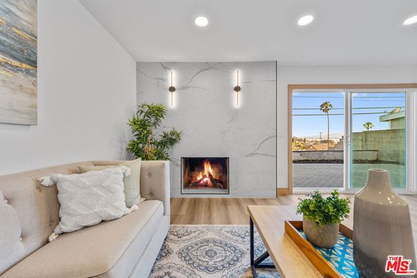 Fireplace, Interior, Marble Walls, Recessed Lighting, Wood Texture Flooring