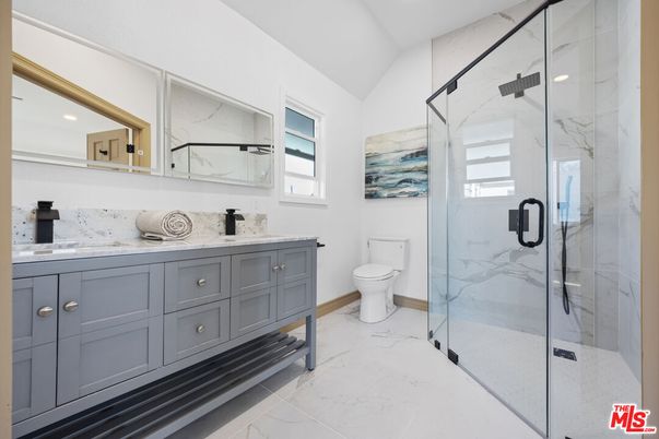 Bathroom, Dual Sink Vanities, Glass Shower, Interior, Marble, Marble Walls, Recessed Lighting