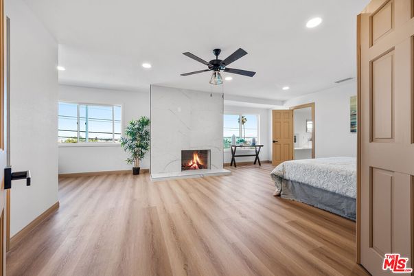 Bedroom, Fireplace, Interior, Marble Walls, Recessed Lighting, Wood Texture Flooring