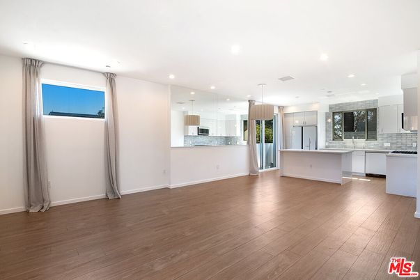Empty room, Interior, Kitchen, Pendant Lights, Recessed Lighting, Stainless Steel Appliances, Wood Texture Flooring