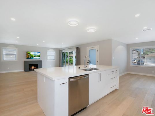 Fireplace, Interior, Kitchen, Recessed Lighting, Stainless Steel Appliances, Wood Texture Flooring