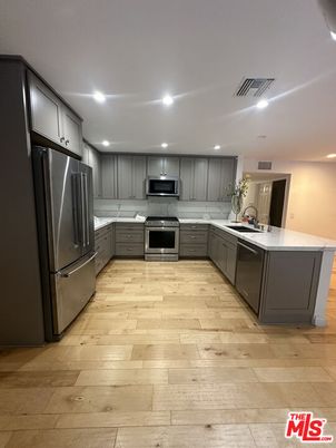 Interior, Kitchen, Recessed Lighting, Stainless Steel Appliances, Wood Texture Flooring