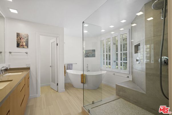 Bathroom, Dual Sink Vanities, Free Standing Baths, Glass Shower, Interior, Recessed Lighting, Wood Texture Flooring