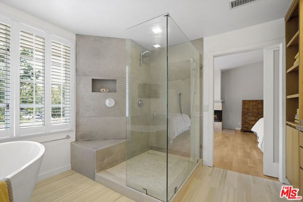 Bathroom, Free Standing Baths, Glass Shower, Interior, Recessed Lighting, Wood Texture Flooring