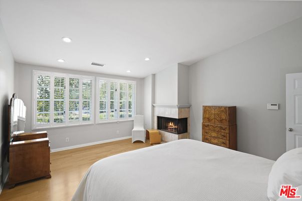 Bedroom, Fireplace, Interior, Recessed Lighting, Wood Texture Flooring
