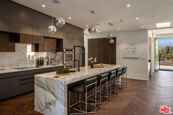 Interior, Kitchen, Marble Walls, Pendant Lights, Recessed Lighting, Stainless Steel Appliances, Wood Texture Flooring