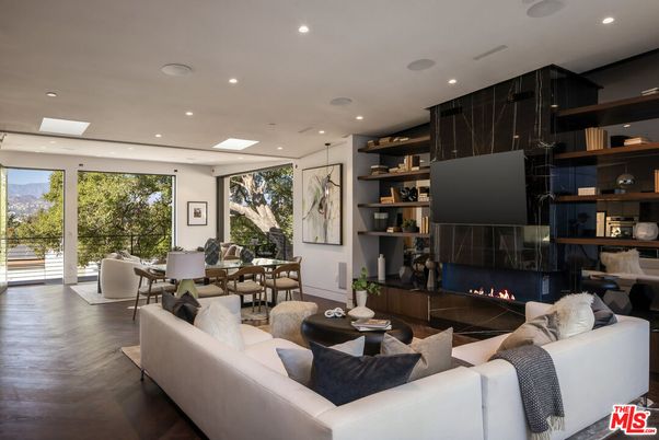 Dining room, Fireplace, Interior, Living room, Recessed Lighting, Wood Texture Flooring
