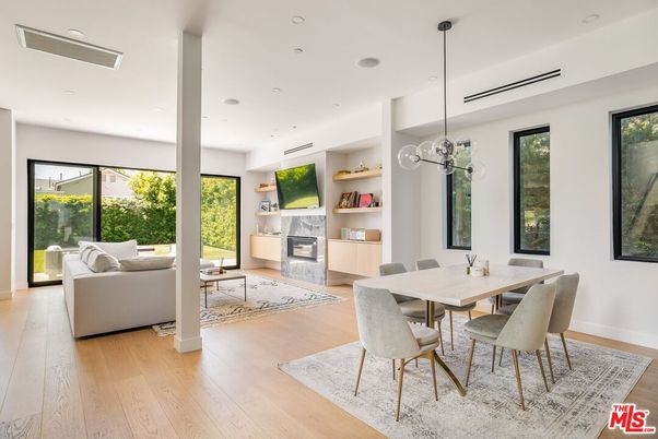 Dining room, Fireplace, Interior, Living room, Pendant Lights, Recessed Lighting, Wood Texture Flooring