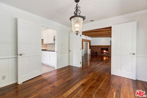 Chandelier, Empty room, Fireplace, Interior, Stone Walls, Wood Texture Flooring