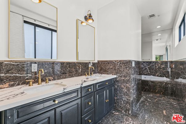 Bathroom, Dual Sink Vanities, Interior, Marble, Marble Walls, Recessed Lighting