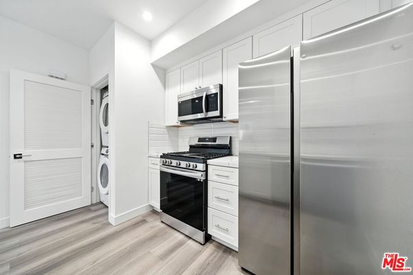 Interior, Kitchen, Recessed Lighting, Stainless Steel Appliances, Washer, Wood Texture Flooring