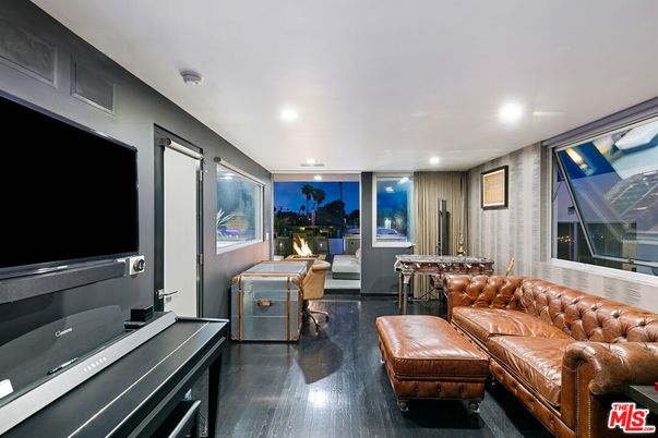 Fireplace, Game Room, Interior, Living room, Recessed Lighting, Wood Texture Flooring