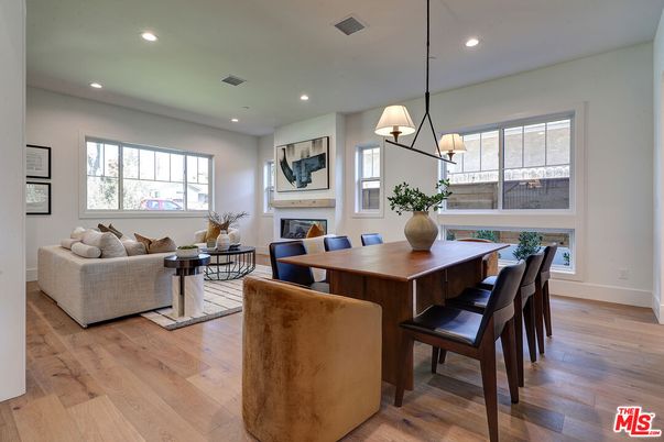Dining room, Fireplace, Interior, Living room, Pendant Lights, Recessed Lighting, Wood Texture Flooring