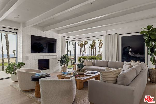Fireplace, Interior, Living room, Recessed Lighting, Stone Walls, Water, Wood Texture Flooring
