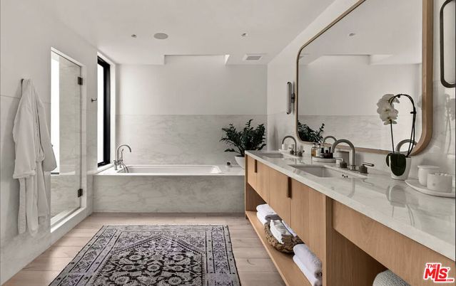 Bathroom, Dual Sink Vanities, Interior, Marble Walls, Recessed Lighting, Wood Texture Flooring