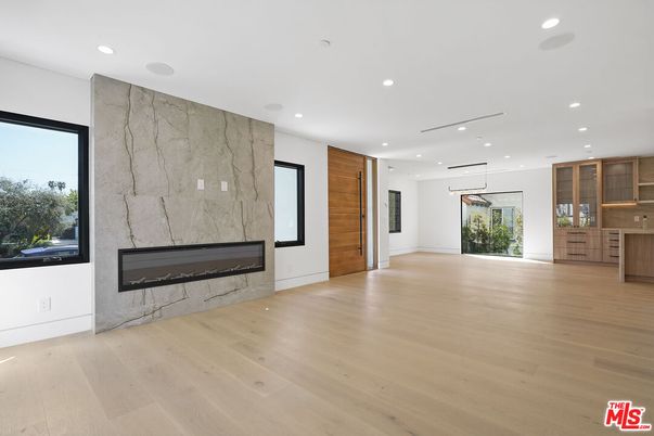 Empty room, Fireplace, Interior, Marble Walls, Pendant Lights, Recessed Lighting, Wood Texture Flooring