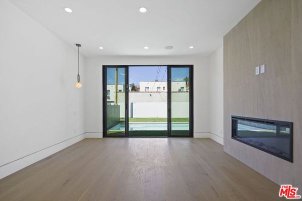 Empty room, Fireplace, Interior, Pendant Lights, Recessed Lighting, Wood Texture Flooring