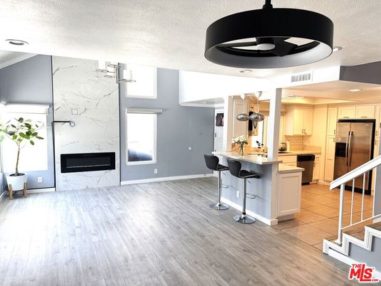 Fireplace, Interior, Kitchen, Marble Walls, Pendant Lights, Recessed Lighting, Wood Texture Flooring